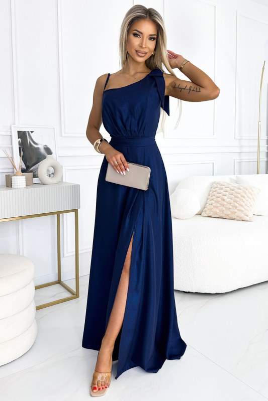 Tmavě modré dlouhé lesklé dámské šaty přes jedno rameno s mašlí 528-1 - Dámské saka